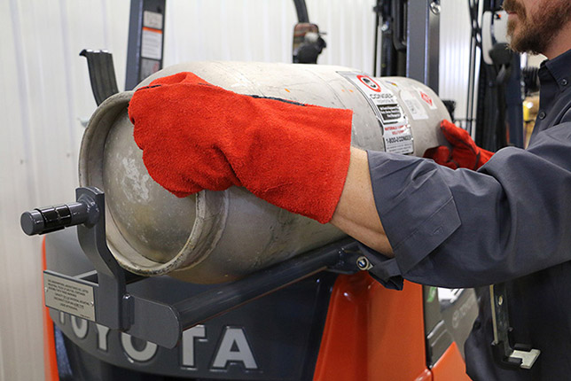 Toyota Forklift Operator Changing the LPG Tank of its lift truck